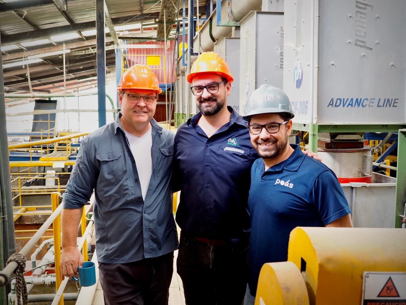 Project leads at a coffee mill processing facility